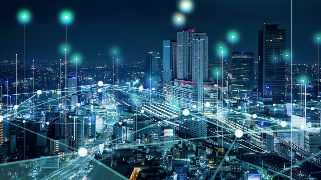 Smart Cities: A nighttime cityscape with connected AI-driven infrastructure.